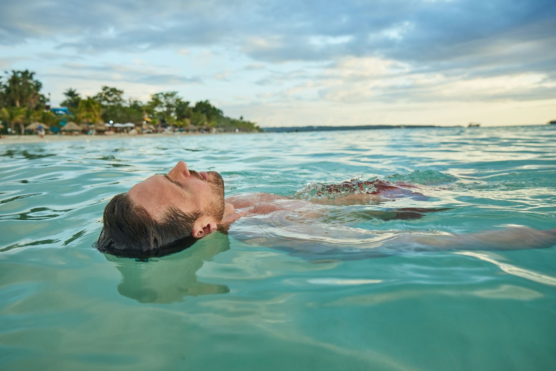 SHOT_11_EVENING-BEACH_MAN FLOATING IN OCEAN