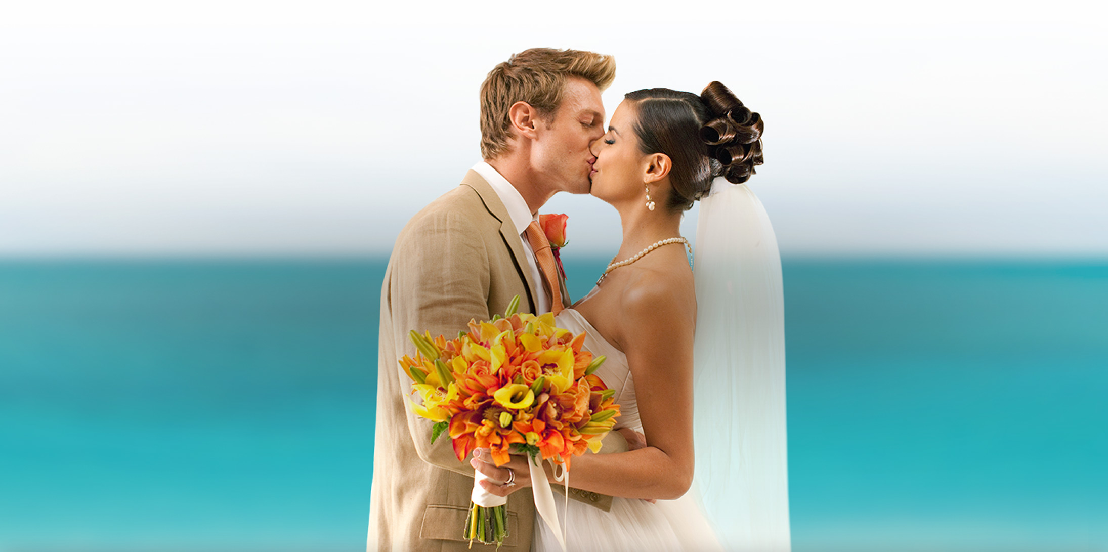 https://cdn.sandals.com/beaches/v12/images/weddings/promotions/bride-and-groom-ocean.jpg