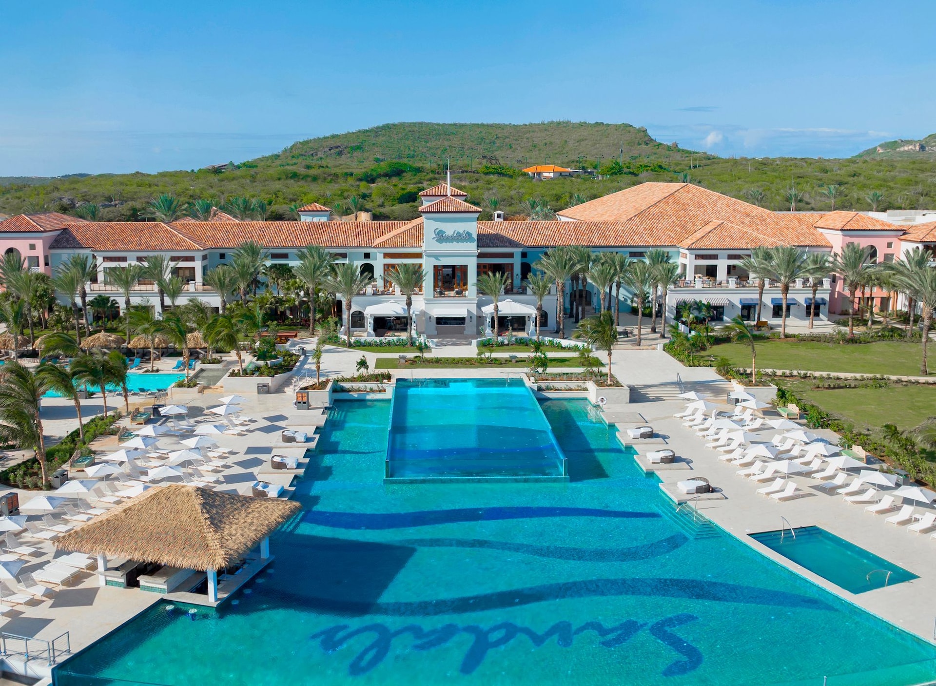 Dos-Awa-Infinity-Pool-at-Sandals-Royal-Curacao-with-expansive-upper-and-lower-decks-overlooking-the-Spanish-Water-and-the-rugged-mountain-landscape--1-