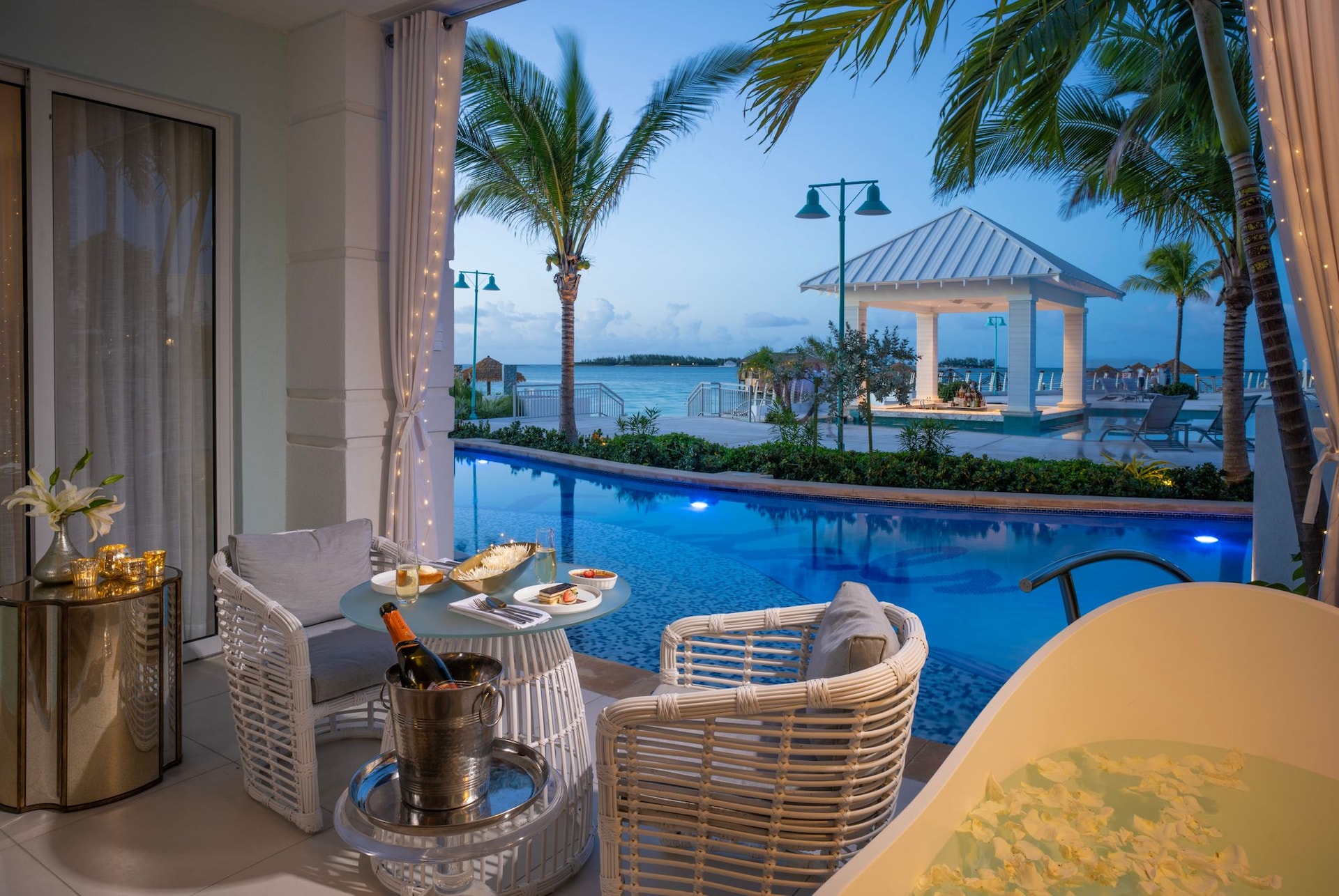 SRB---OS1B---West-Bay-One-Bedroom-Oceanview-Swim-up-Butler-Suite-with-Patio-Tranquility-Soaking-Tub---Patio-Night
