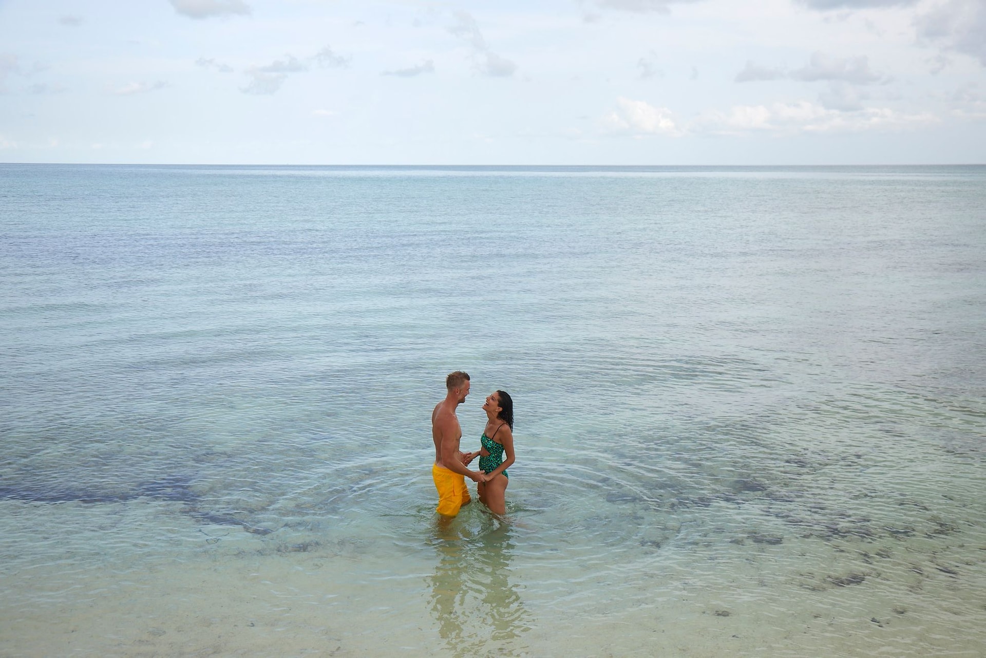 SRB-Lifestyle-Couple-Holding-Hands-Shallow-Water-1