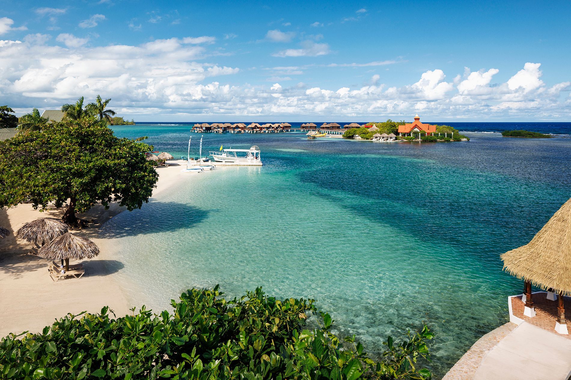 white sand and blue water at sandals caribbean cay