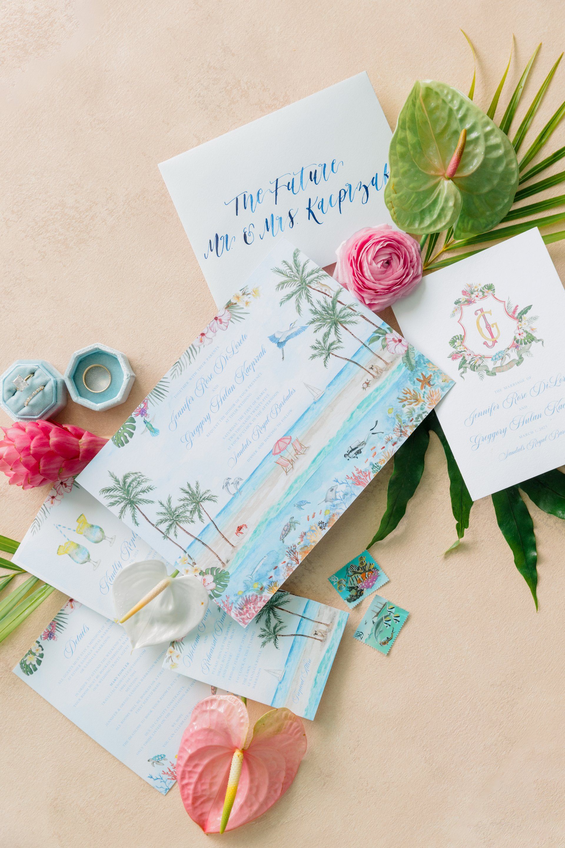 Tropical wedding invitation suite with watercolor artwork and Caribbean floral details