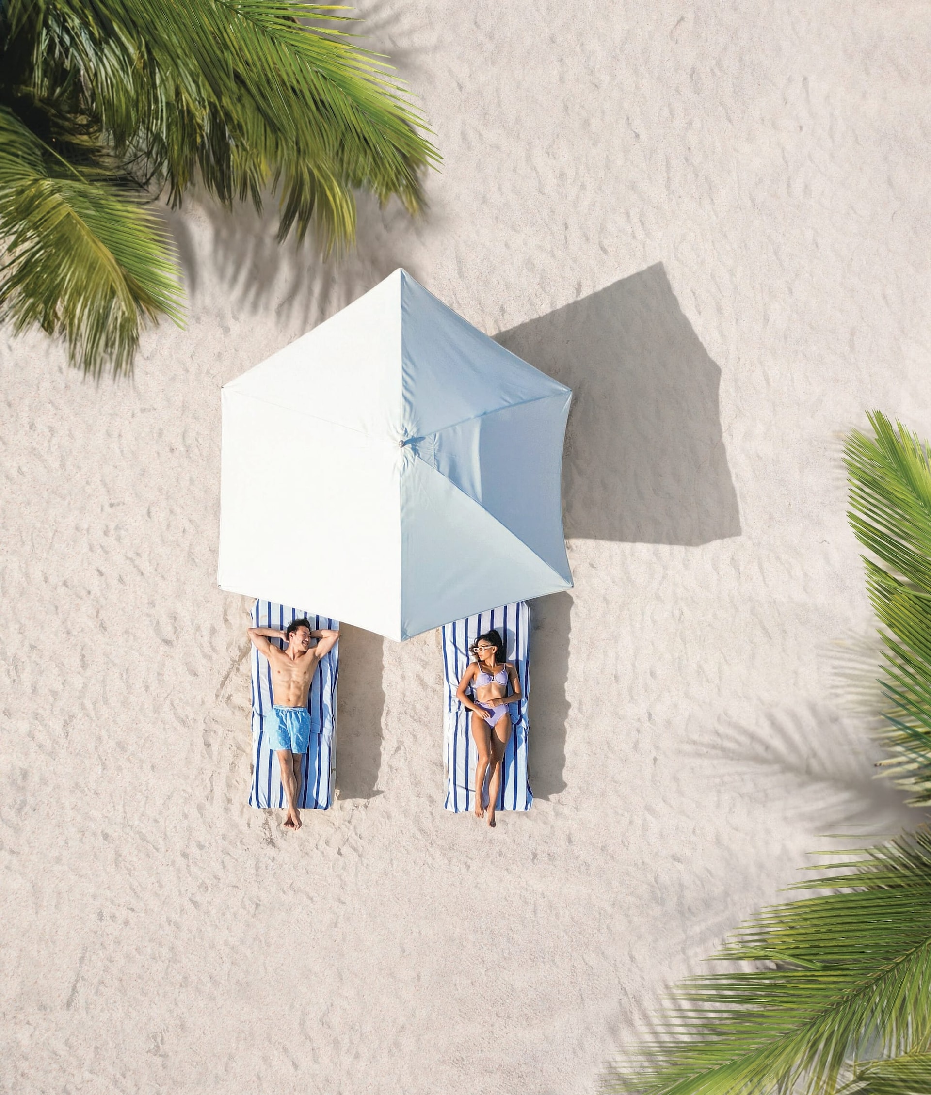 JPG Version-SDR-Lifestyle-Couple-Beach-Laying-Out.jpg