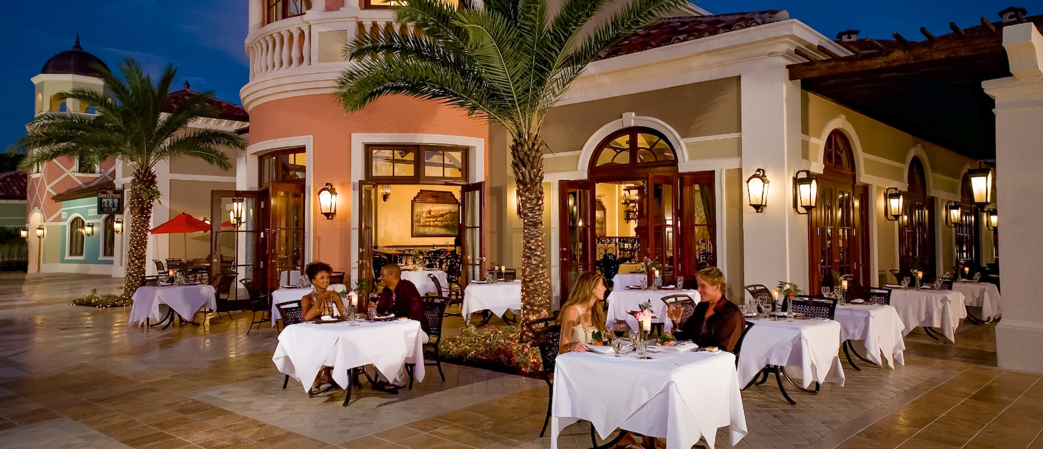 Two couples having dinner at Mario's in Sandas Grande Antigua