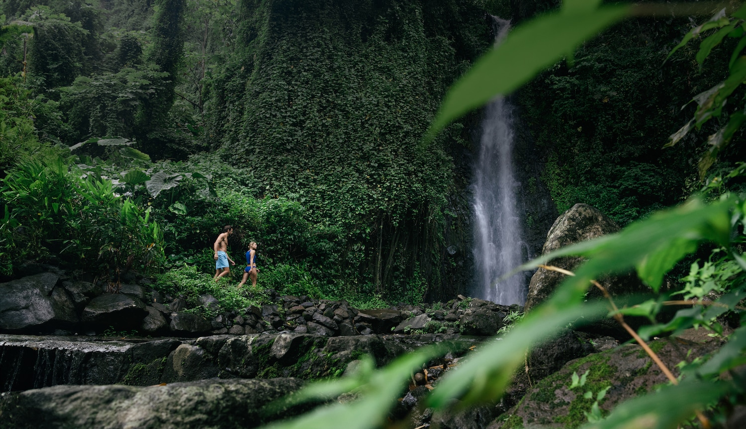 Couple relaxing in over-the-water villa