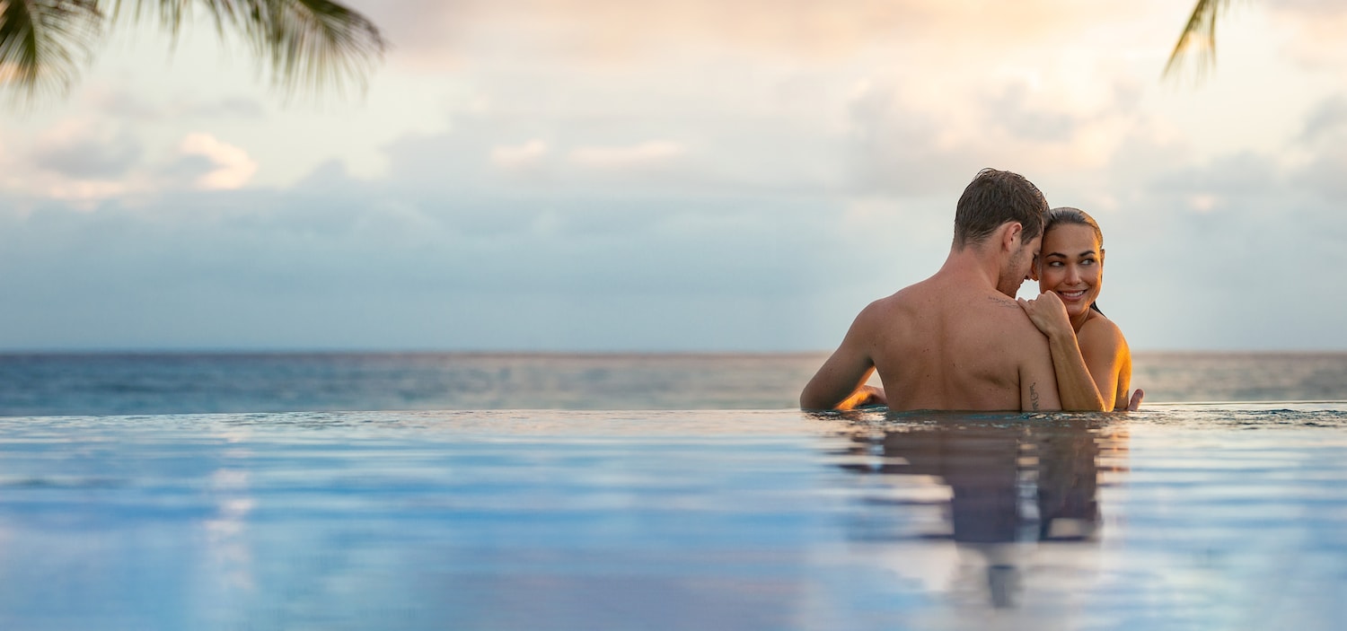 couple in the pool watching see