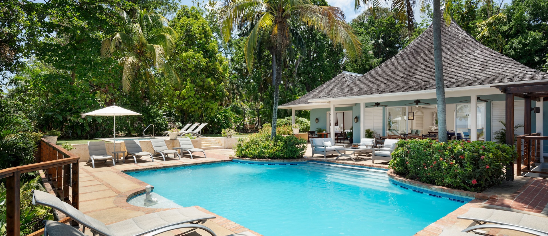 Beautiful Pool Area, blue water and lots of chairs to relax