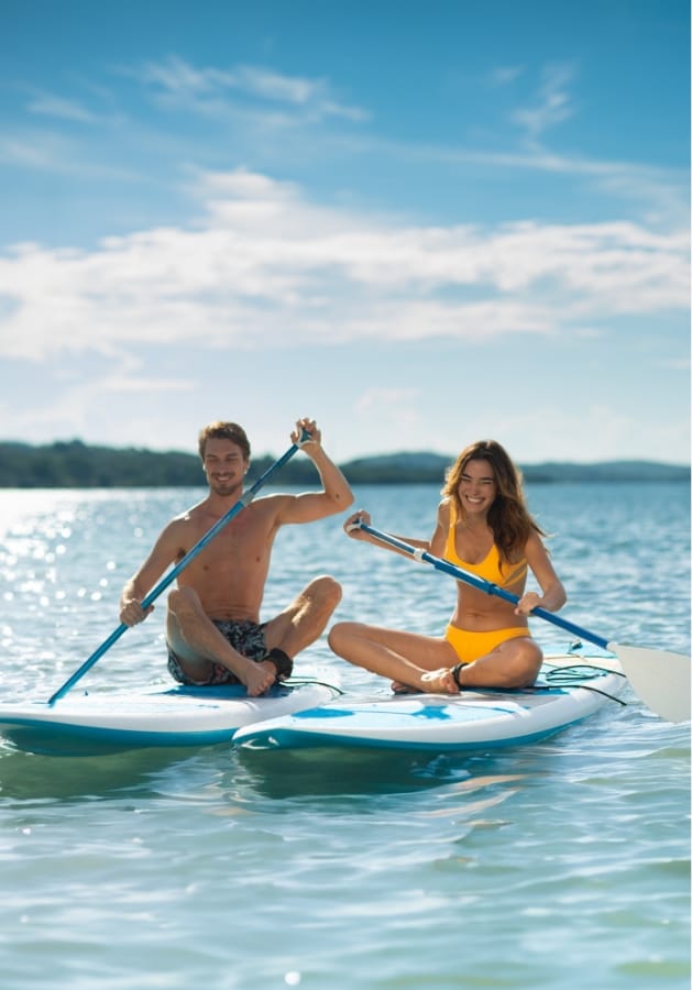 Couple on surfboards