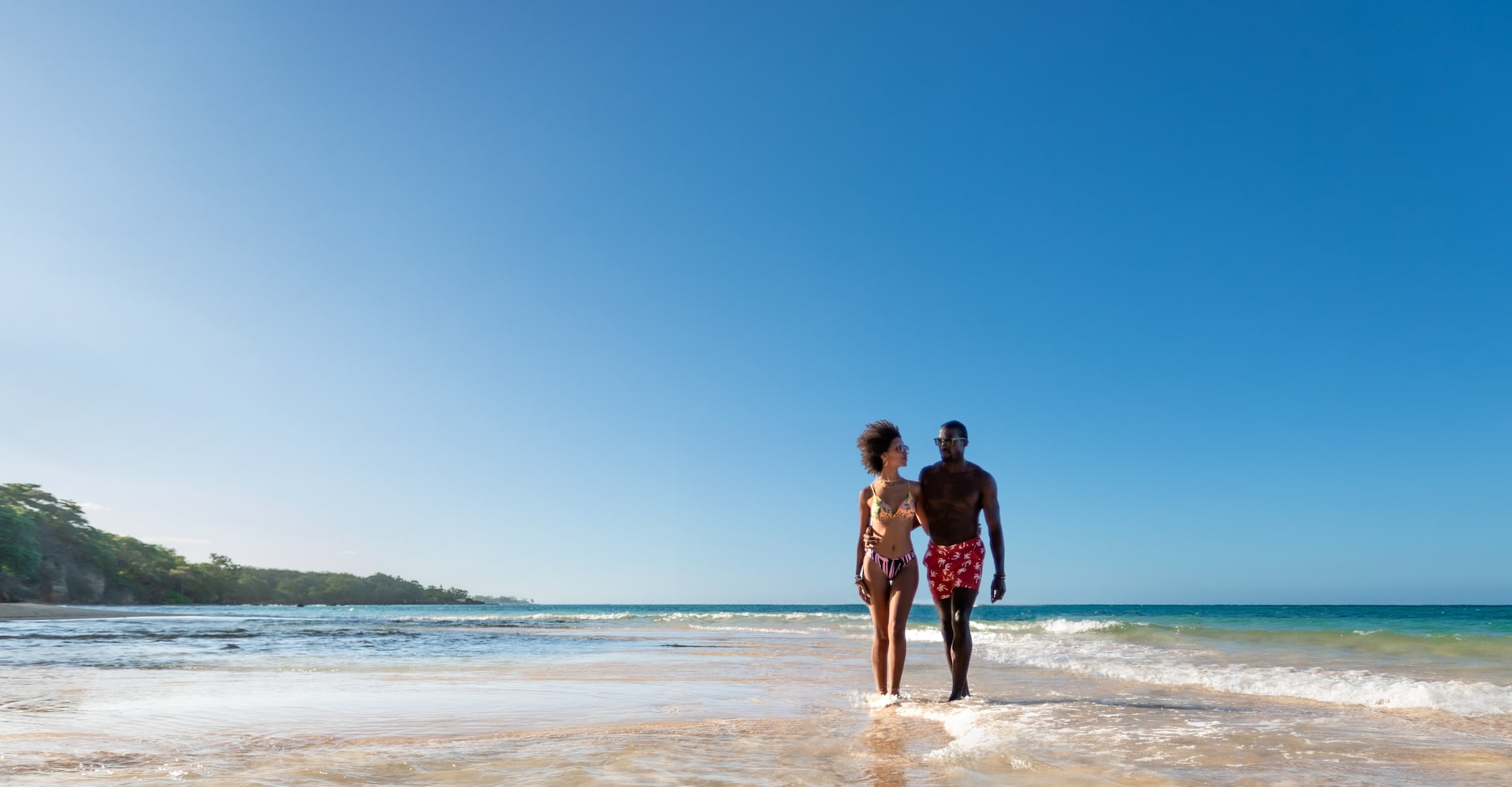 Couple walking on the beach