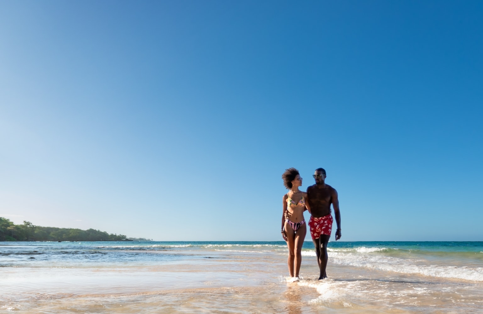 Couple walking on the beach