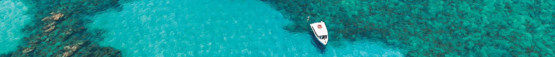 Boat on clear turquoise water