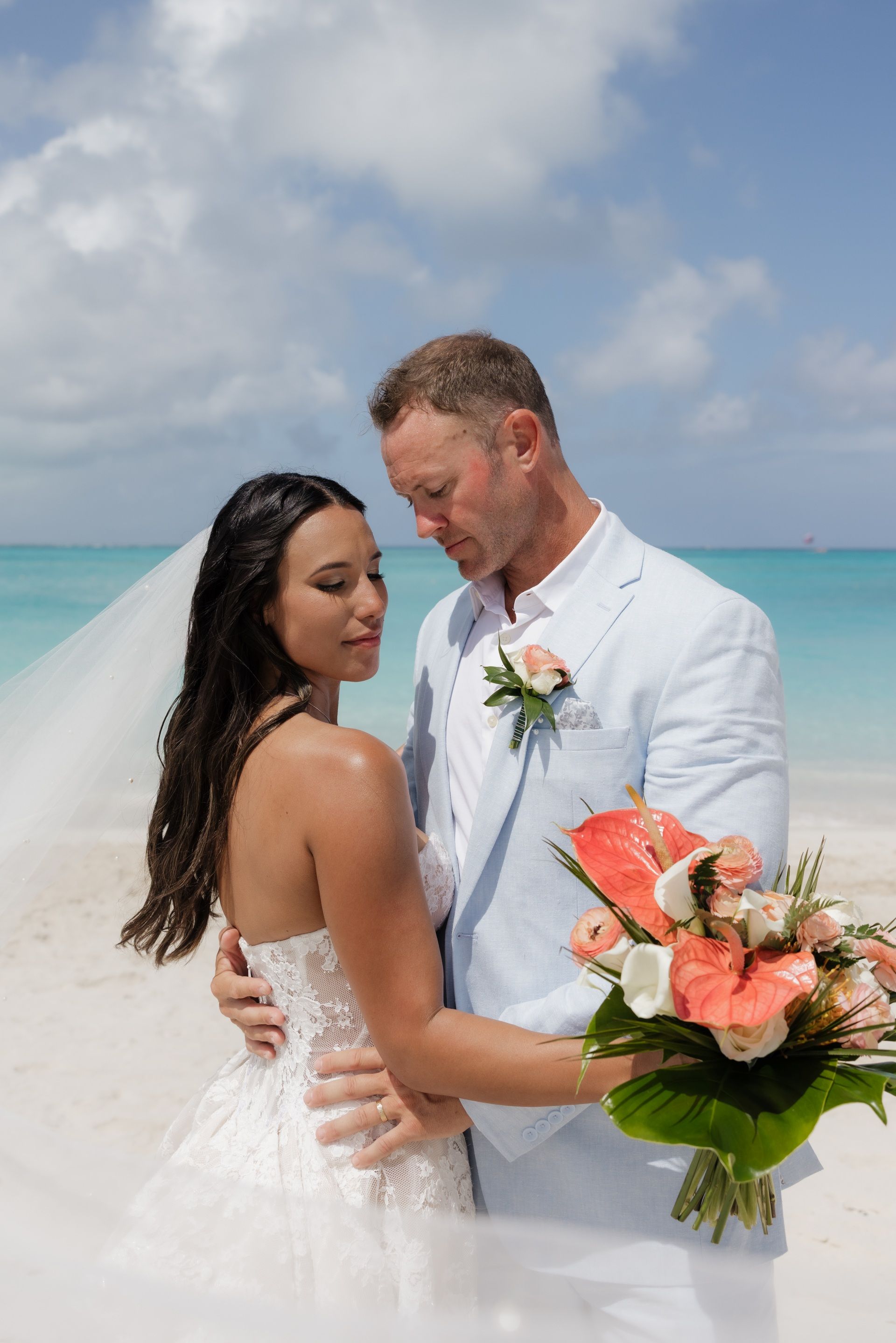 Bride and groom sharing an intimate moment on Grace Bay Beach at Beaches Turks and Caicos