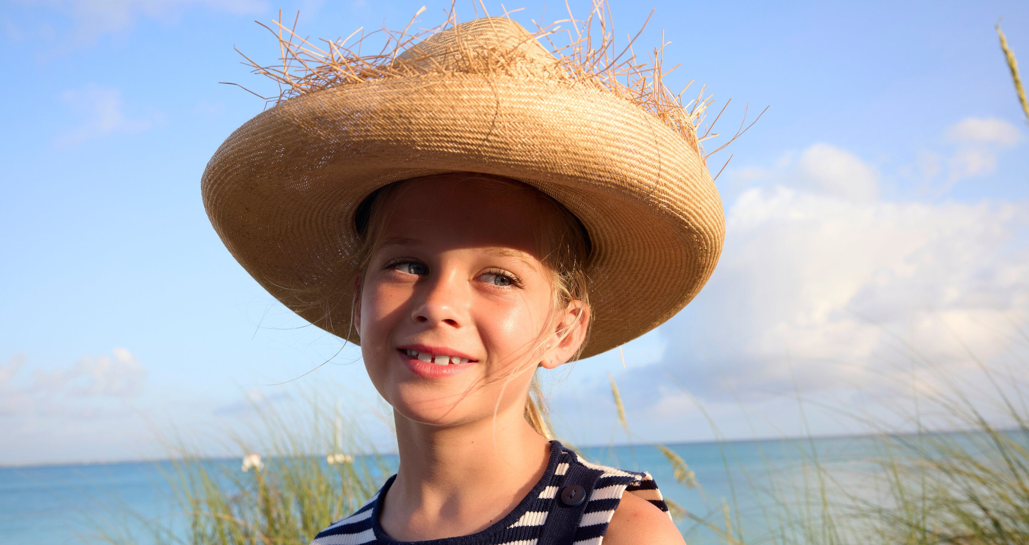 Web Version-BTC-Lifestyle-Girl-Straw-Hat-Striped-Shirt.jpg