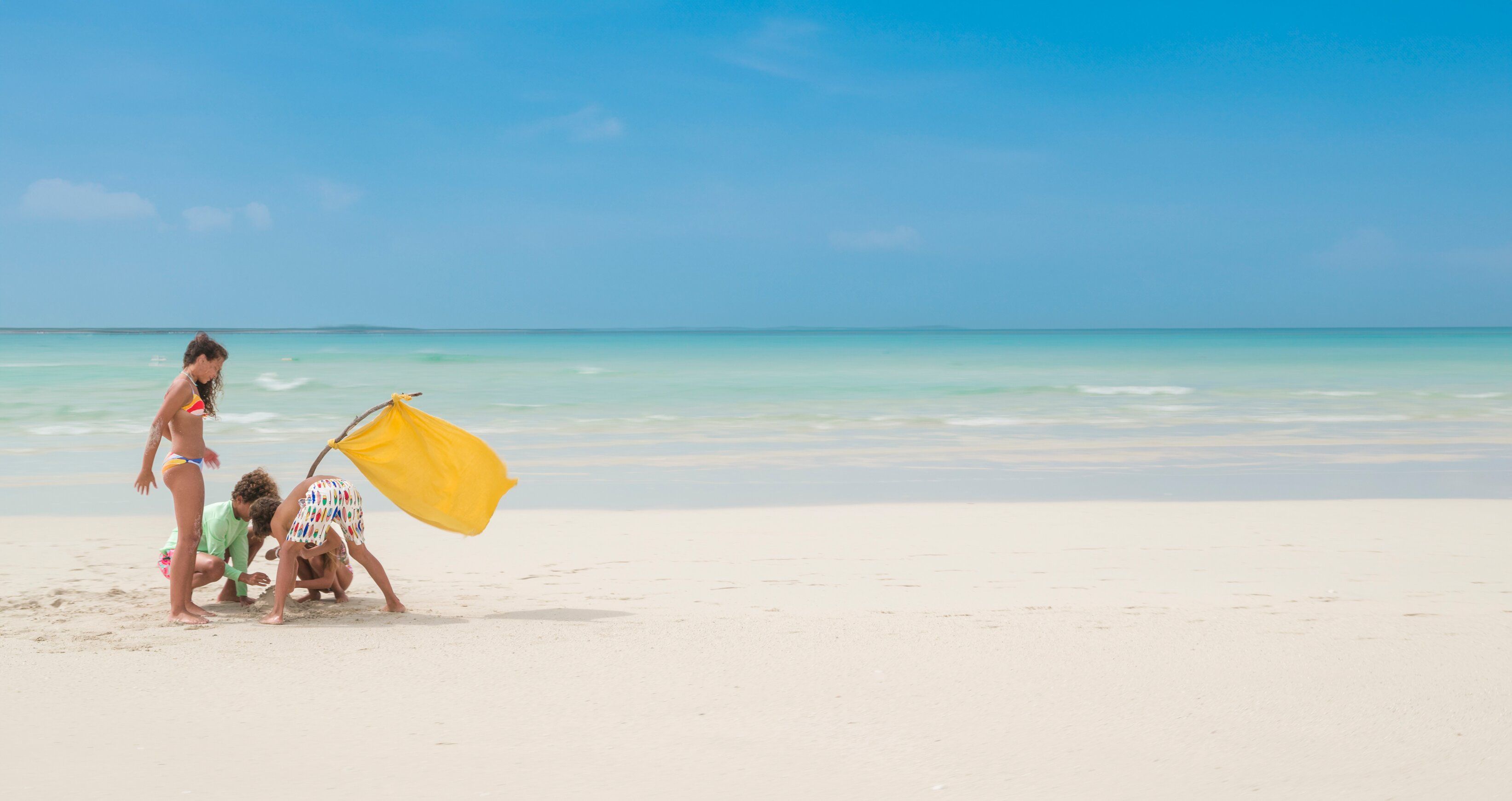 Web Version-BTC-Lifestyle-Kids-Planting-Flag-Sandbar.jpg